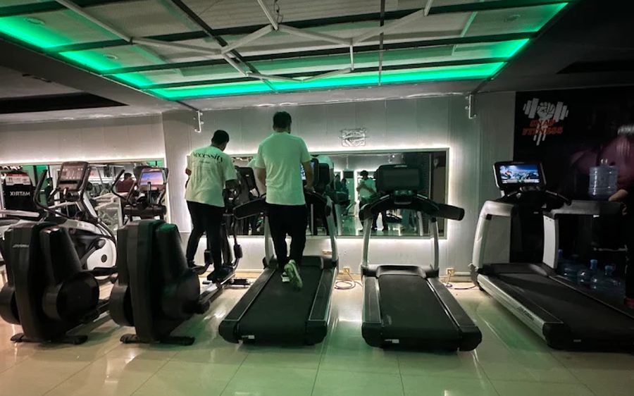 Members using the treadmills during late-night hours